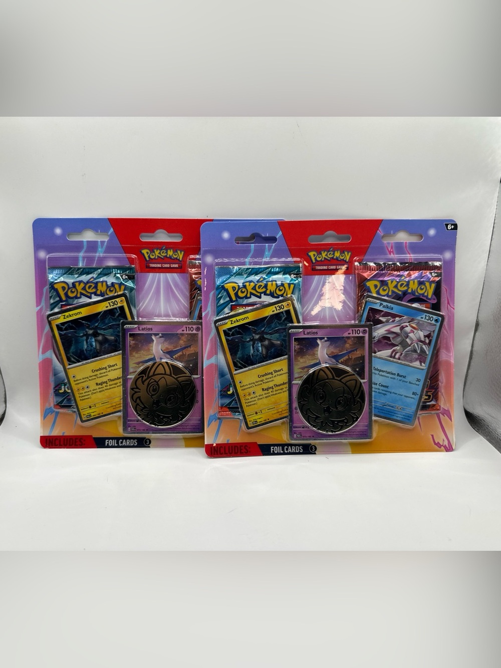 Pokemon Trading Card Blister Packs with Purple and Red Artwork